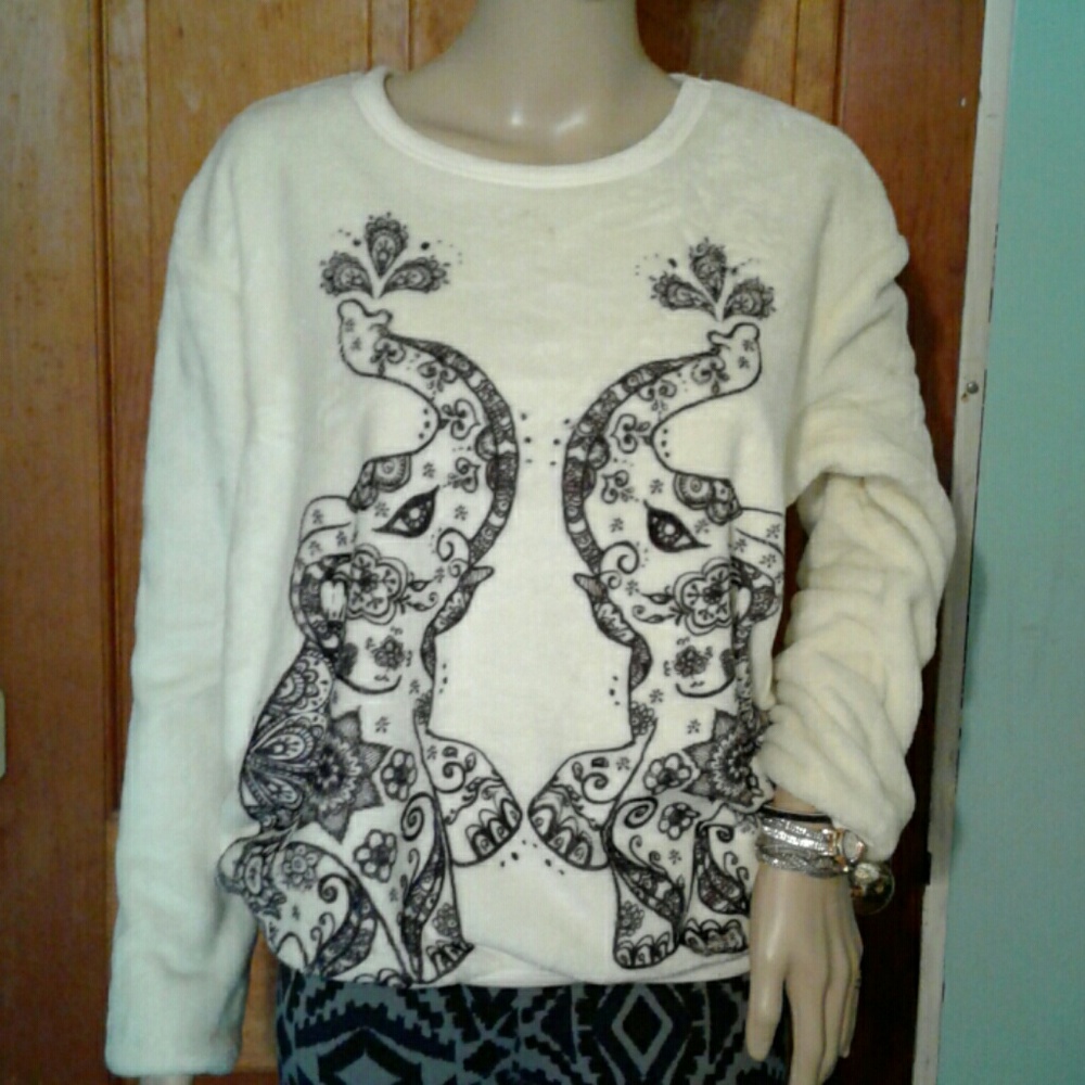 White/ cream sweater with elephants on it