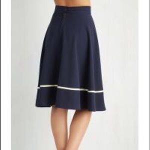 Navy blue, high waisted circle skirt.