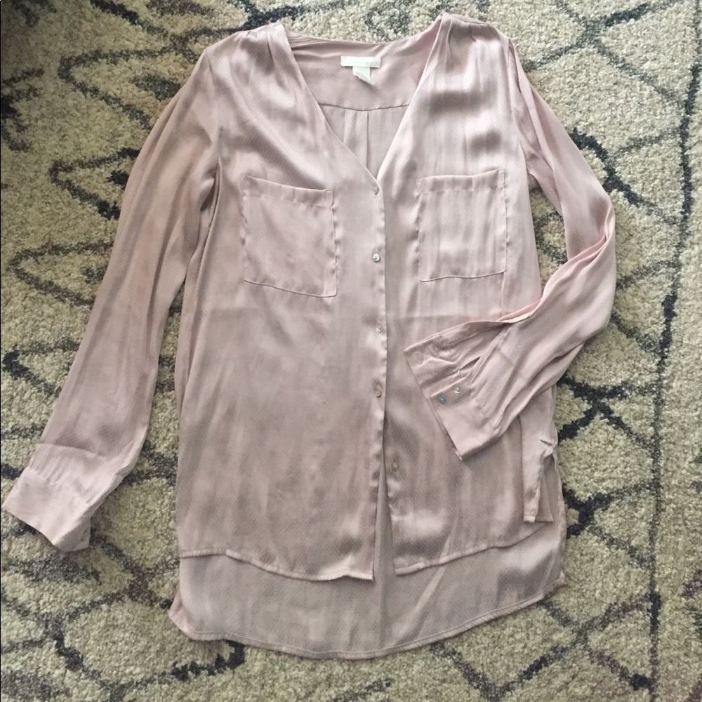 Long-sleeve, baby pink blouse.