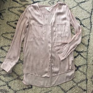 Long-sleeve, baby pink blouse.