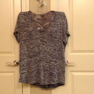 Short sleeved light weight v-neck knit top.
