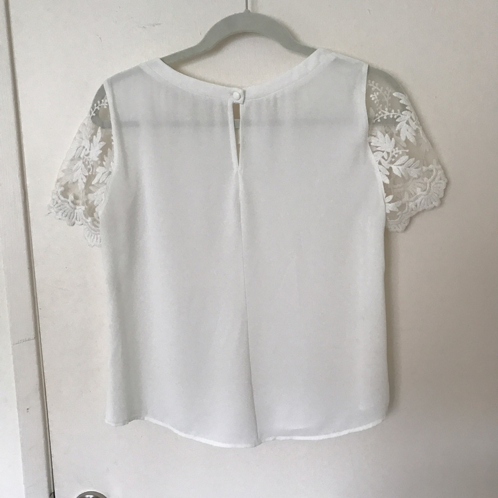 Lush white blouse with lace sleeves. Size M