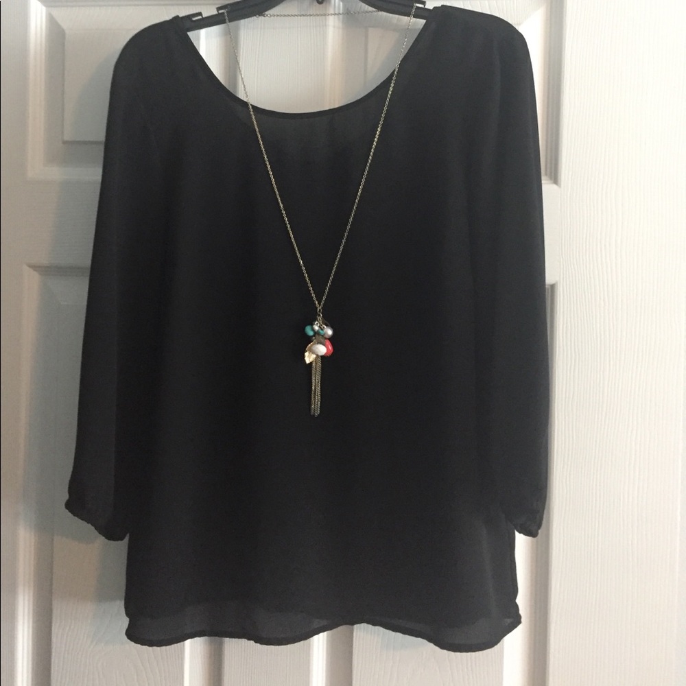 Black ruffled back top