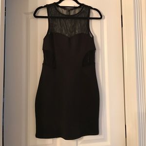Black short dress. Sheer top and back. Size Medium