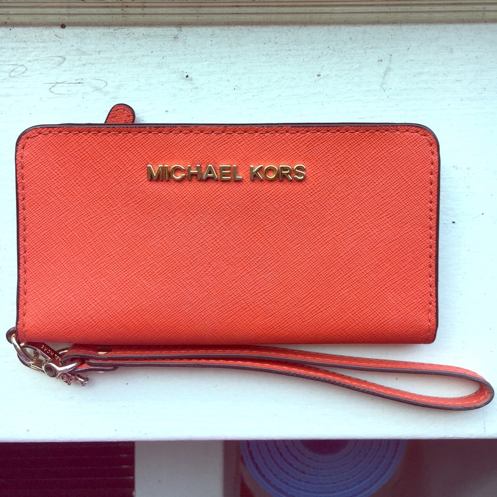 Michael Kors orange wristlet