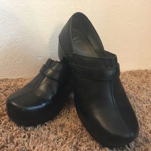 Gently worn black Dansko slip-ons, size 39