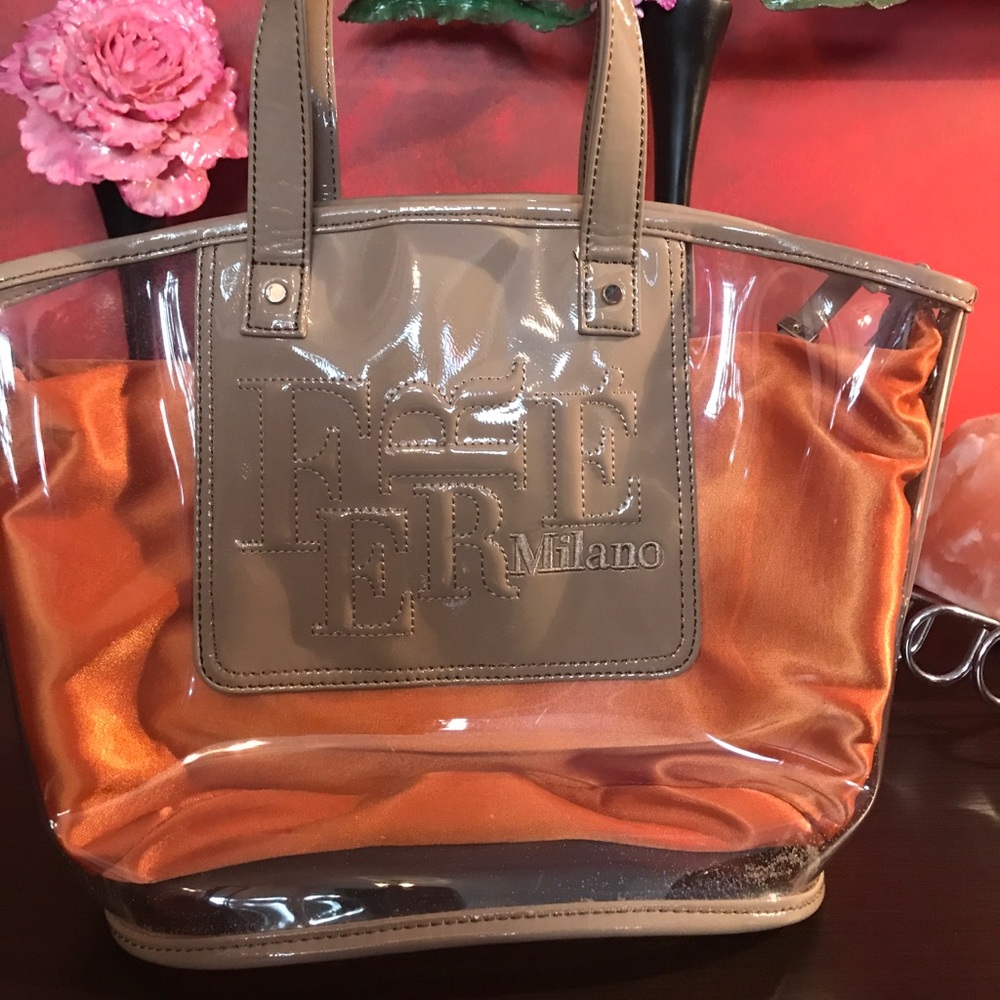 Ferre Milano brand new plastic and silk bag.