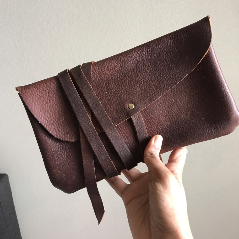 Hustle and hide leather clutch.