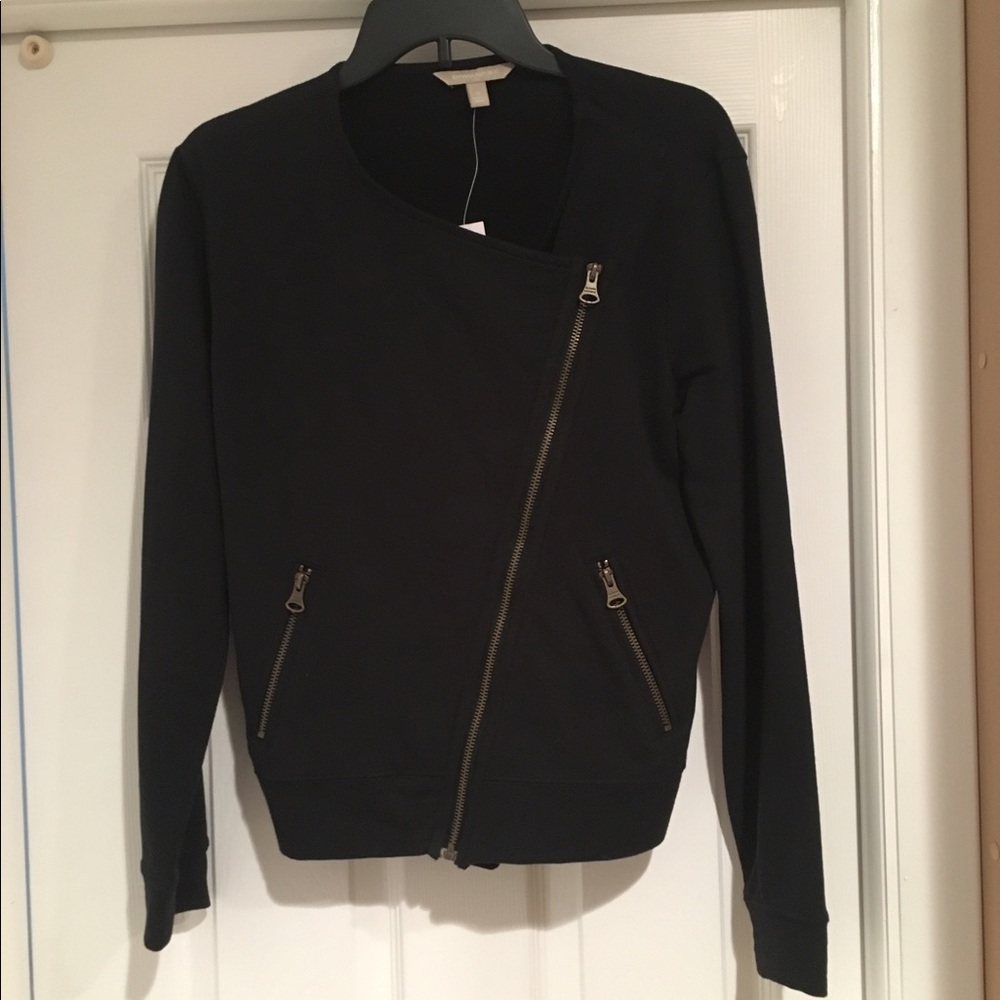 Black moto style jacket with gold zipper details.