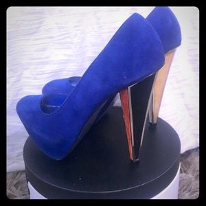 Blue suede BEBE pumps with colorful heel.