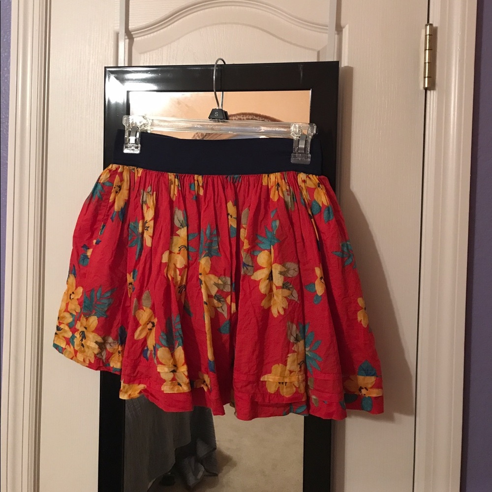 Red with yellow floral skirt