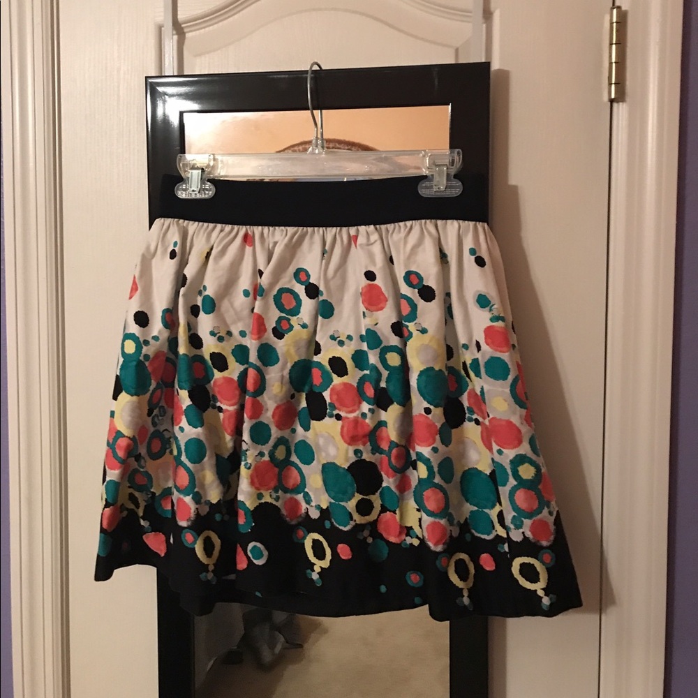 White skirt with pink, teal, and yellow spots