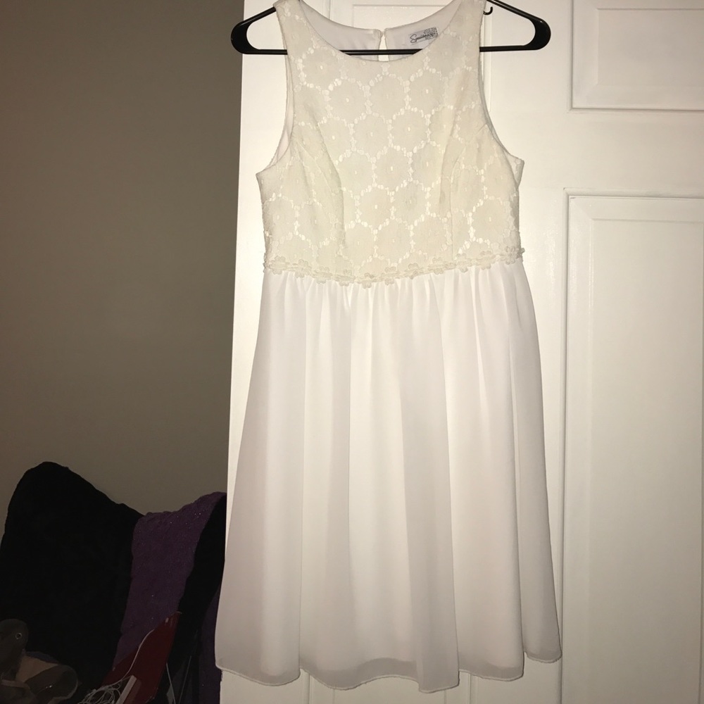 White dress with flowers embroidered