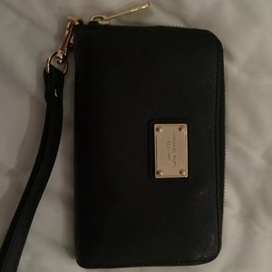 A Michael Kors black wristlet