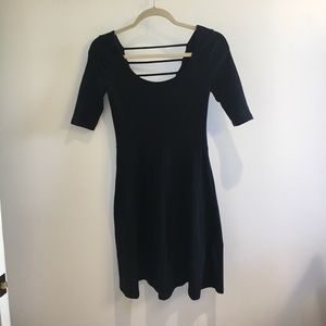 Black skater dress with striped cutouts