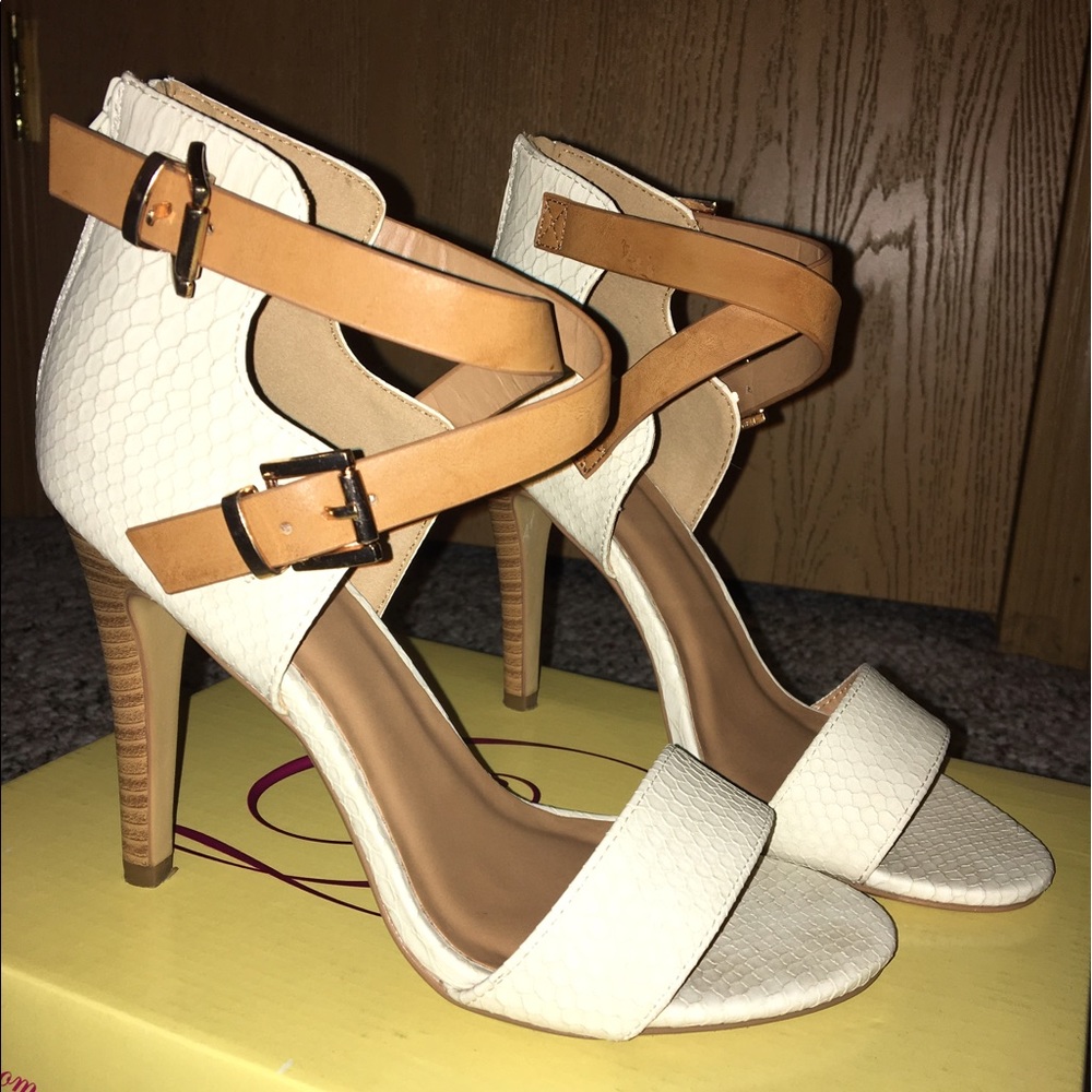 Cream Snake skin strap heels with tan accent.