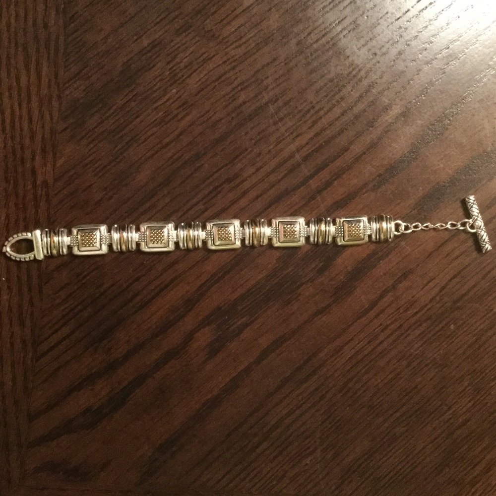Silver bracelet with gold design in links