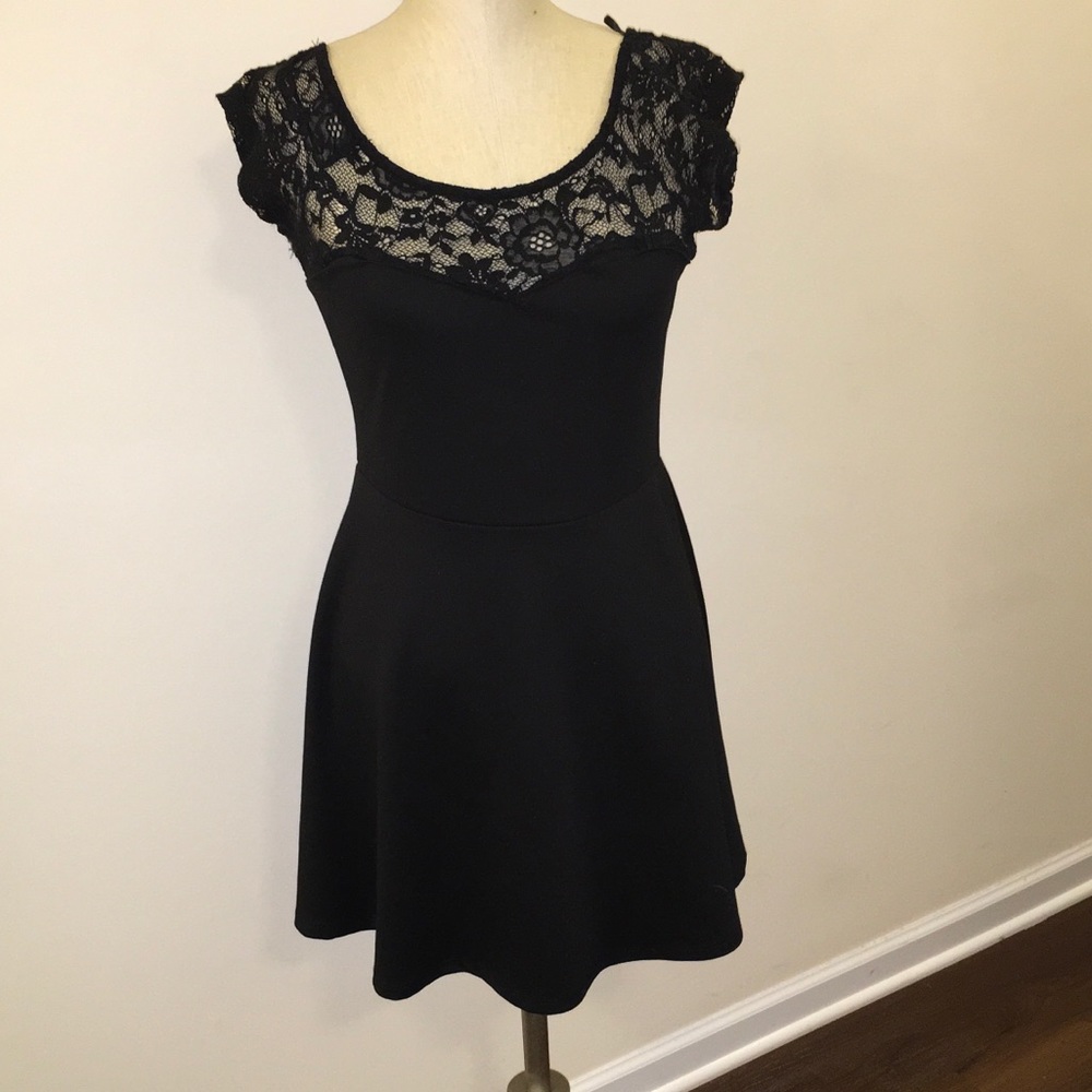 Size Large black dress with lace detail.