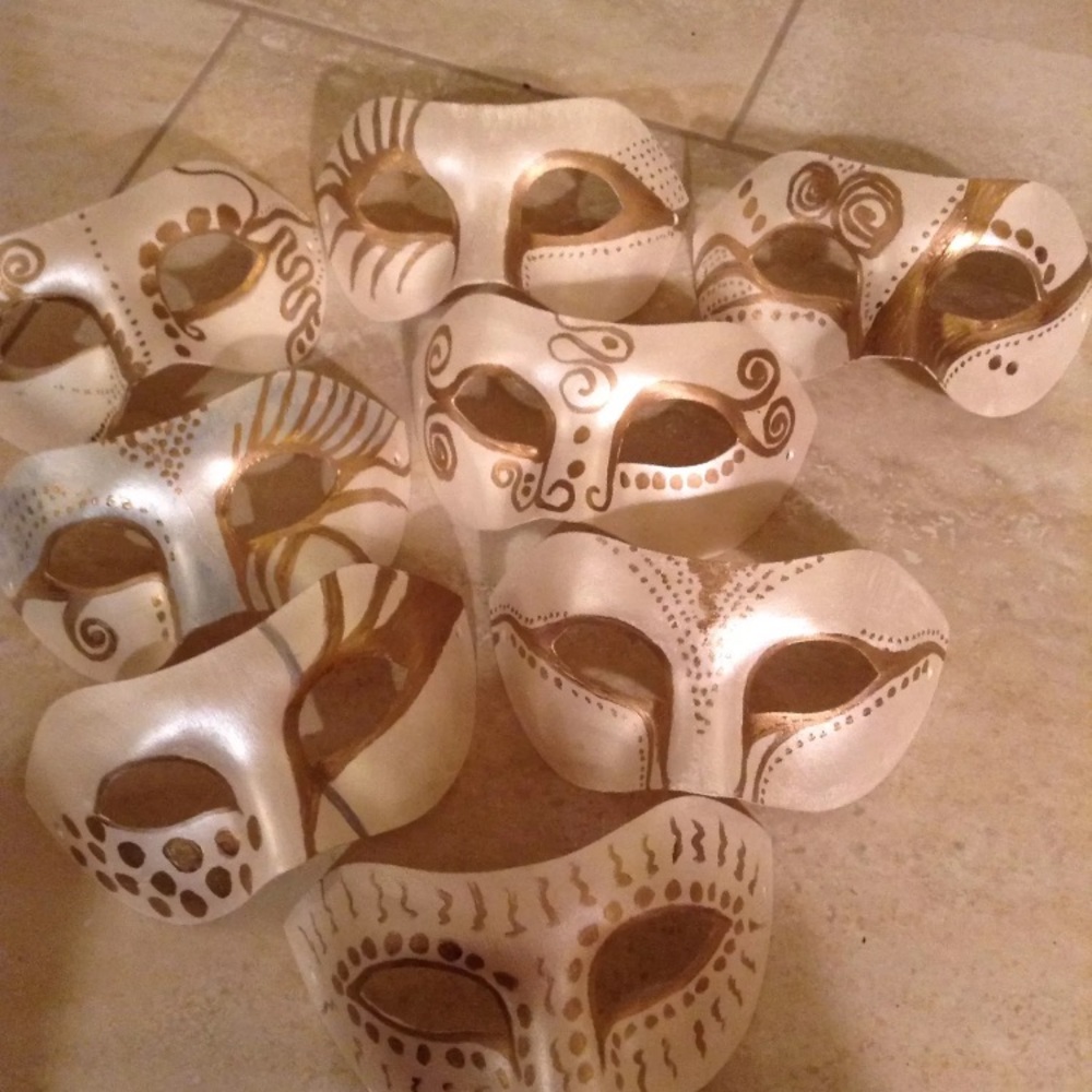 8 hand painted papier-mâché wedding masks