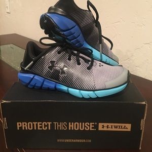 Under Armour kids shoes size 13.5 never worn.