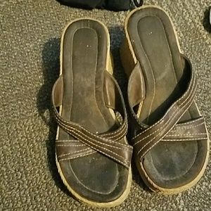 A pair of brown sandals
