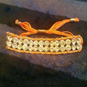 Orange cord and rhinestone bracelet