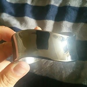 Express pewter color metal hinged bracelet