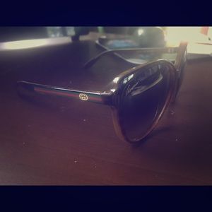 Gucci sunglasses with case and authenticity.