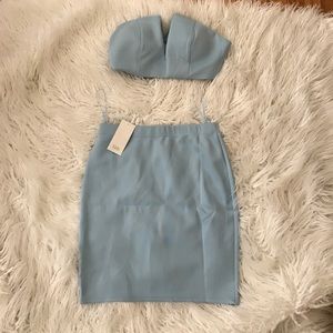 A two piece blue going out crop and skirt