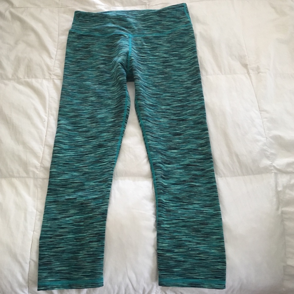 Green, space-dyed Fabletics cropped yoga tights