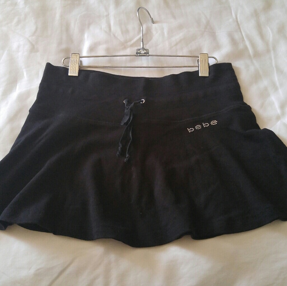 Black bebe cotton flowy mini skirt