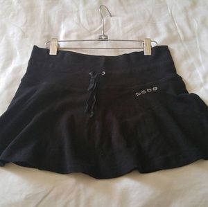 Black bebe cotton flowy mini skirt