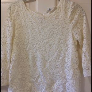 An H&M white lace button back shirt