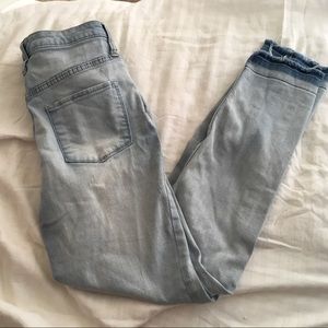 Light wash high rise skinny jeans.