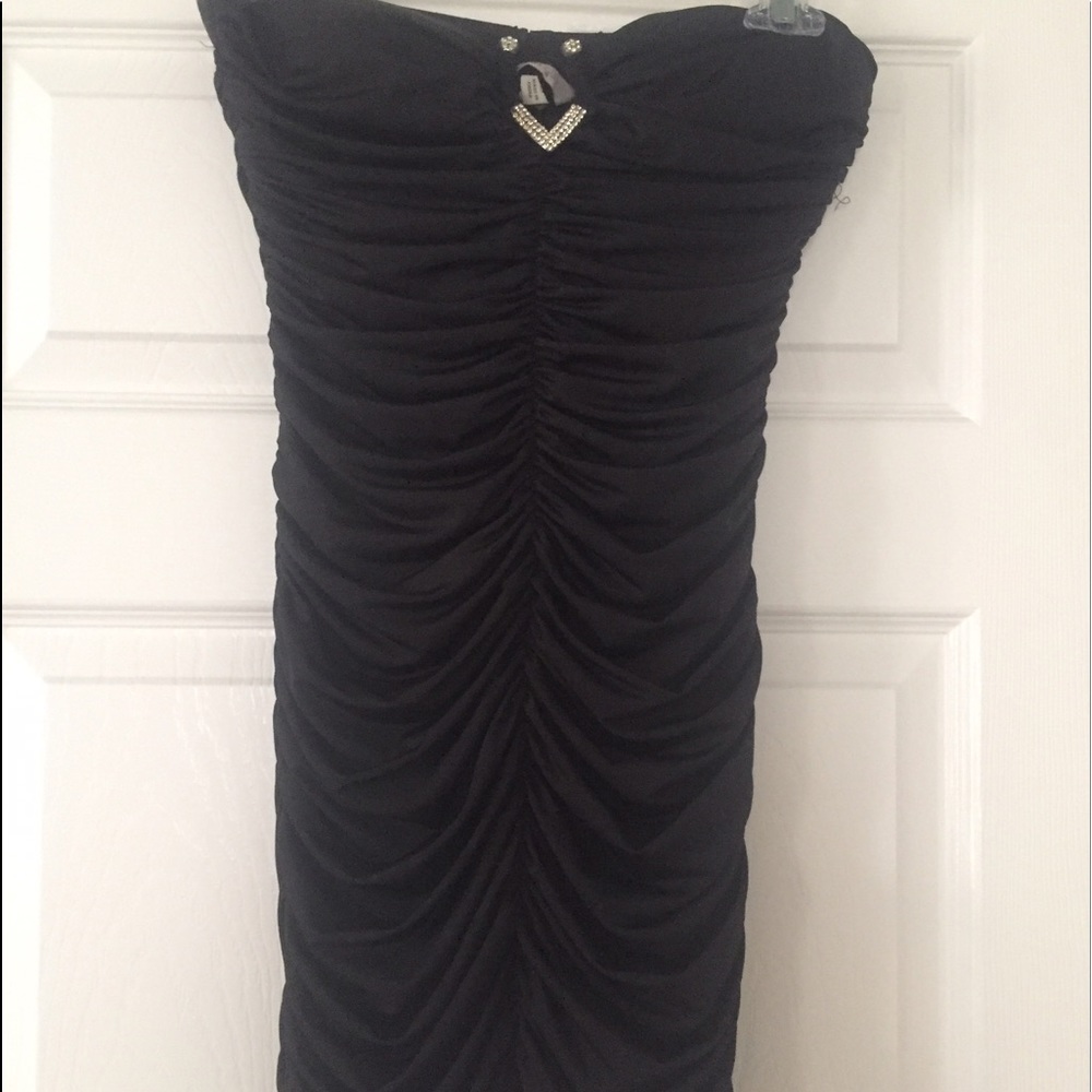 Strapless small gathered form fitting black dress