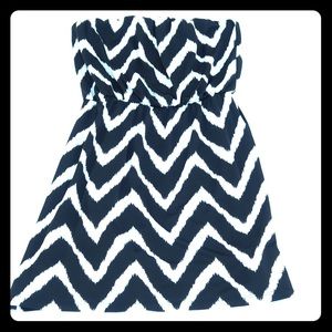 Black and white strapless dress.