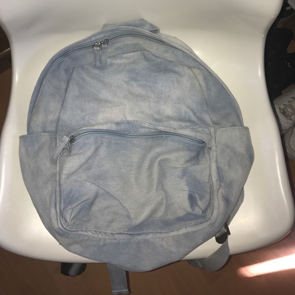 Denim backpack w/ three zippered pockets