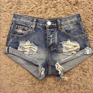 Distressed denim shorts