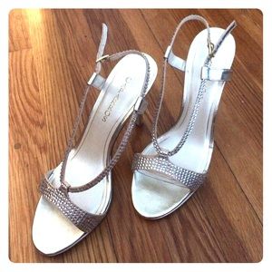 Gold heels with studded band.
