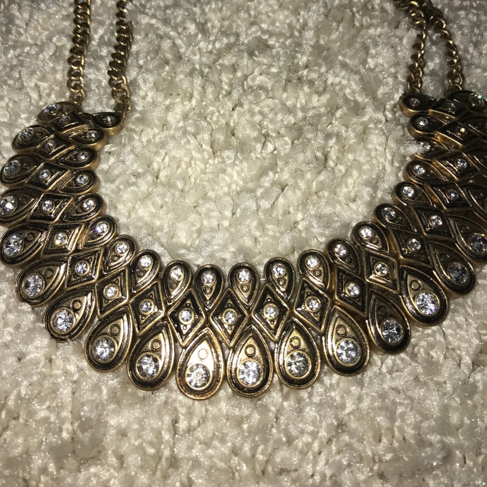 Chunky gold toned and diamond costume jewelry.