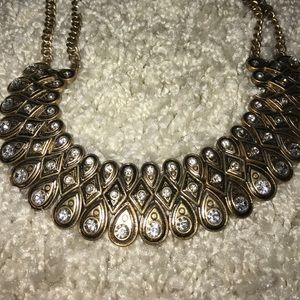 Chunky gold toned and diamond costume jewelry.