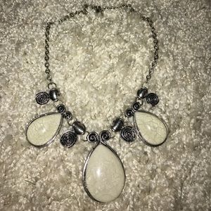 White and silver necklace.