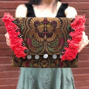 Embroidered Clutch Tassels detailing