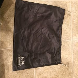 Satin coach dust bag for a purse