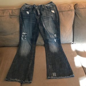 Hydraulic distressed flared leg jeans