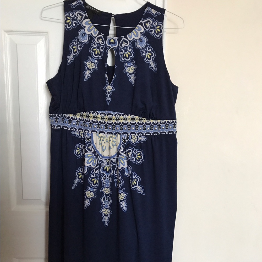 Navy blue cocktail dress with jewel burst design.