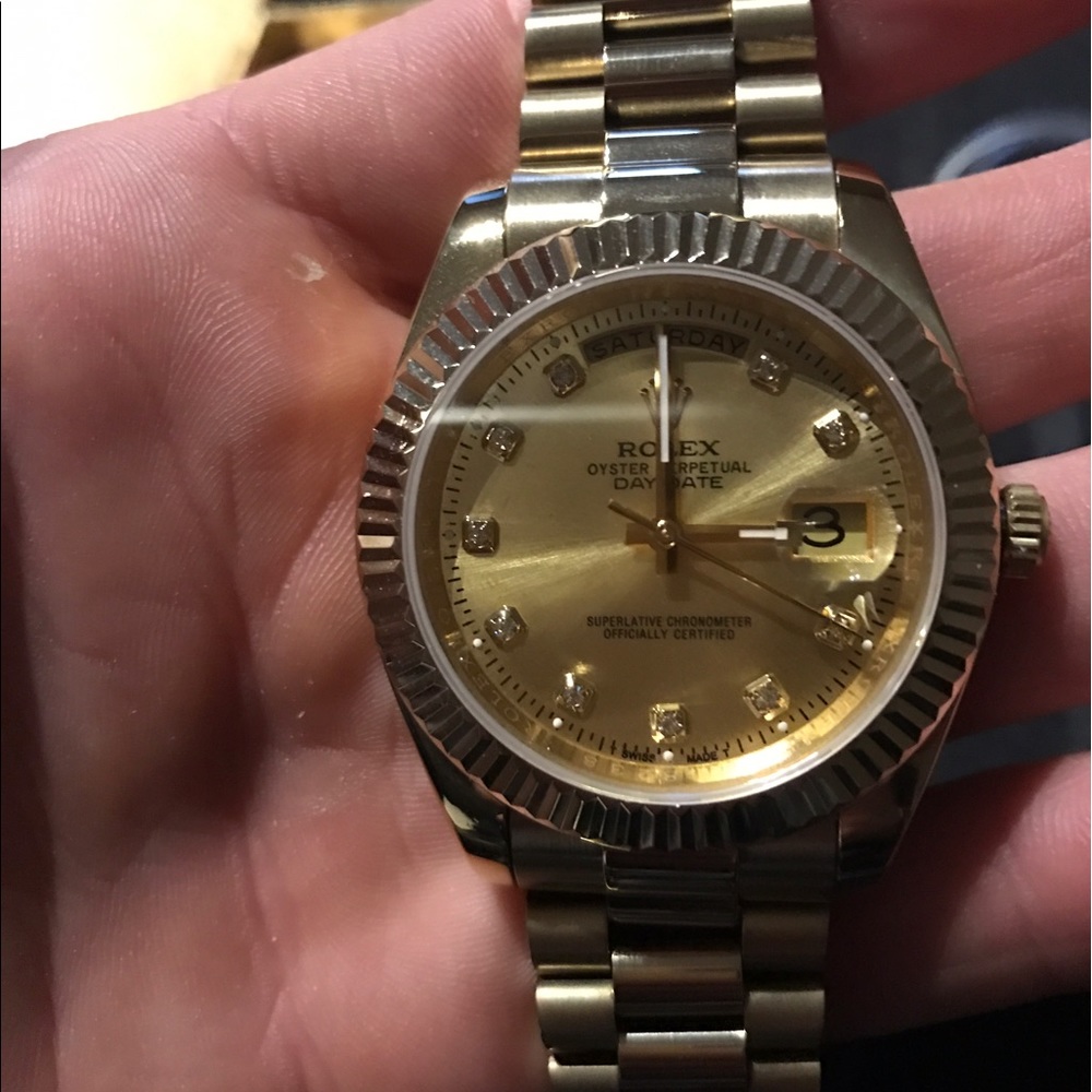 Gold rolex day date watch