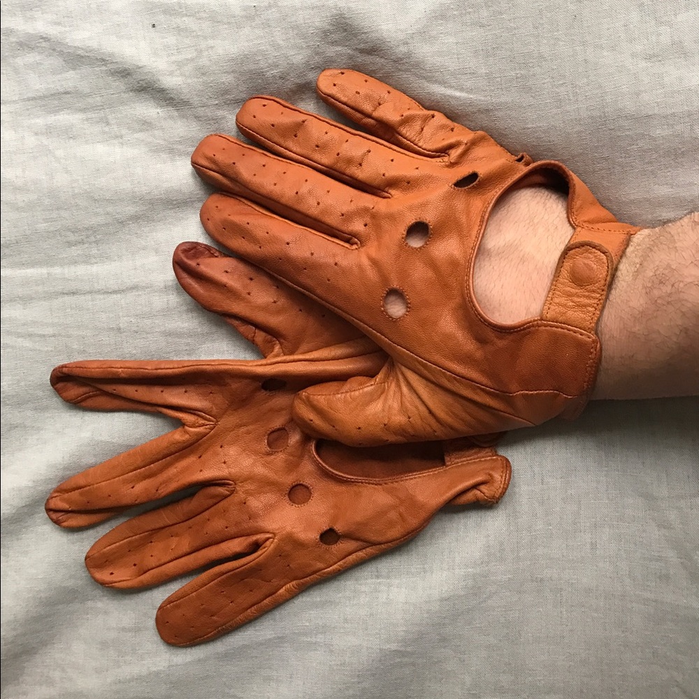 Tan leather riding gloves.