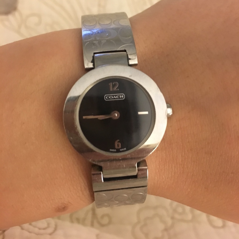 Authentic silver coach watch with black face