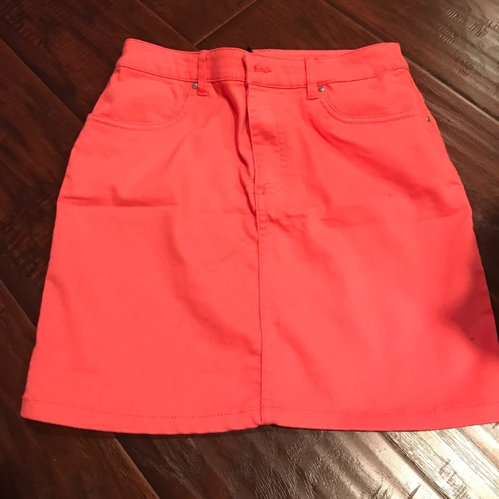 Salmon colored form fitted mini skirt
